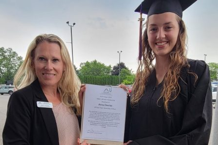 Sarah Foshay of Elgin Business Resource Centre in St. Thomas, Ontario presenting smiling graduate Anna Devries with the 2023 Helen LeFrank Scholarship.